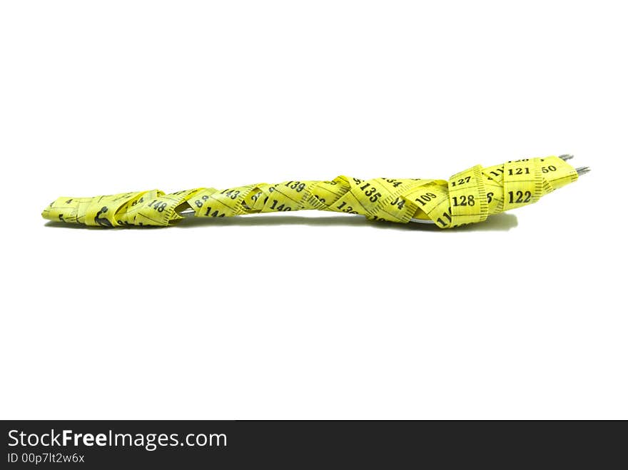 Close-up of an fork  with a measuring tape around it
 Great diet concept.