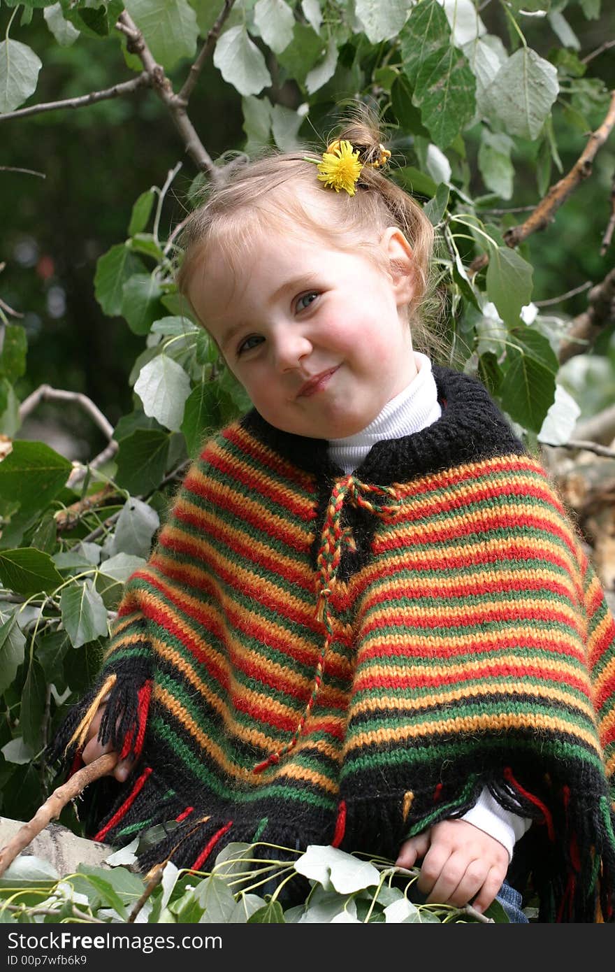 Smiley little girl sit on tree branch. Smiley little girl sit on tree branch