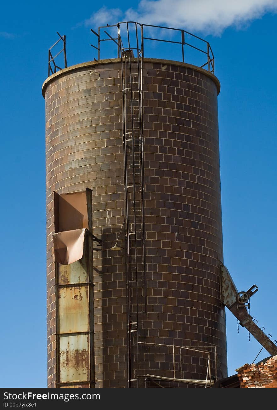 A brick tower for an abandoned electric plant in Walsenburg, Colorado with a very blue sky. A brick tower for an abandoned electric plant in Walsenburg, Colorado with a very blue sky.