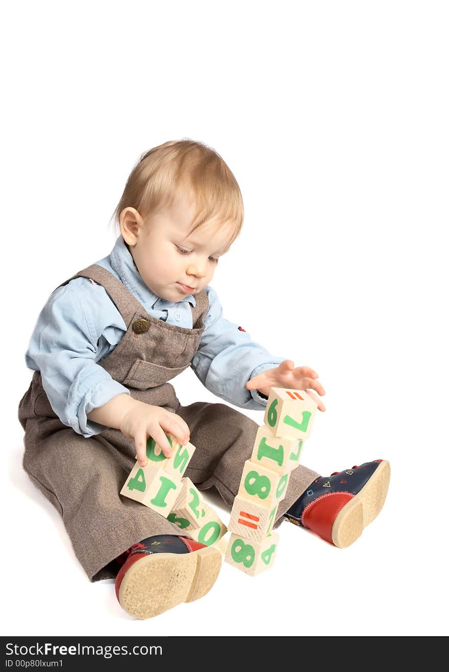 One year boy plays cubes