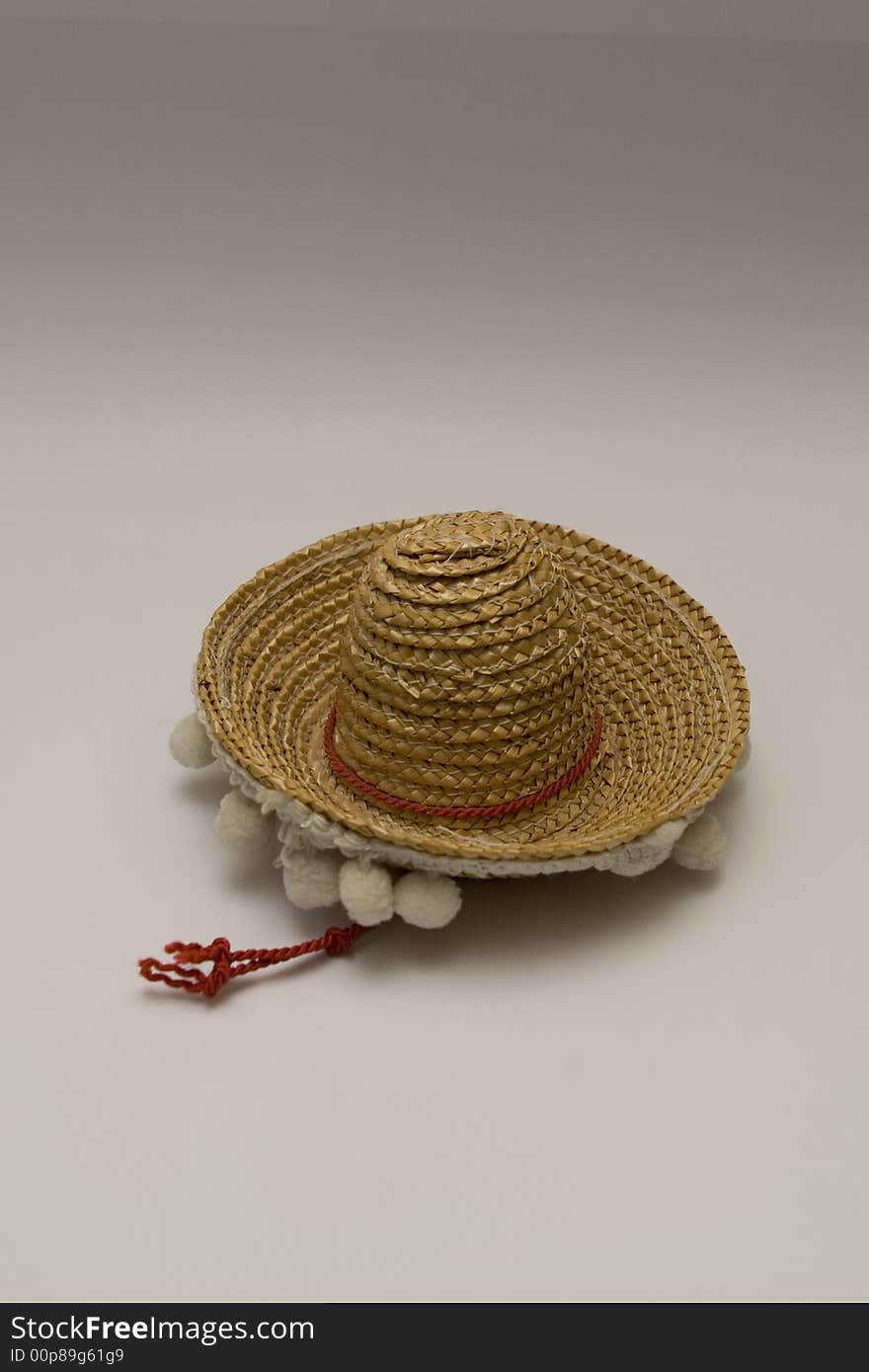 Novelty Miniature mexican yellow straw Sombrero hat with white trimming. Novelty Miniature mexican yellow straw Sombrero hat with white trimming