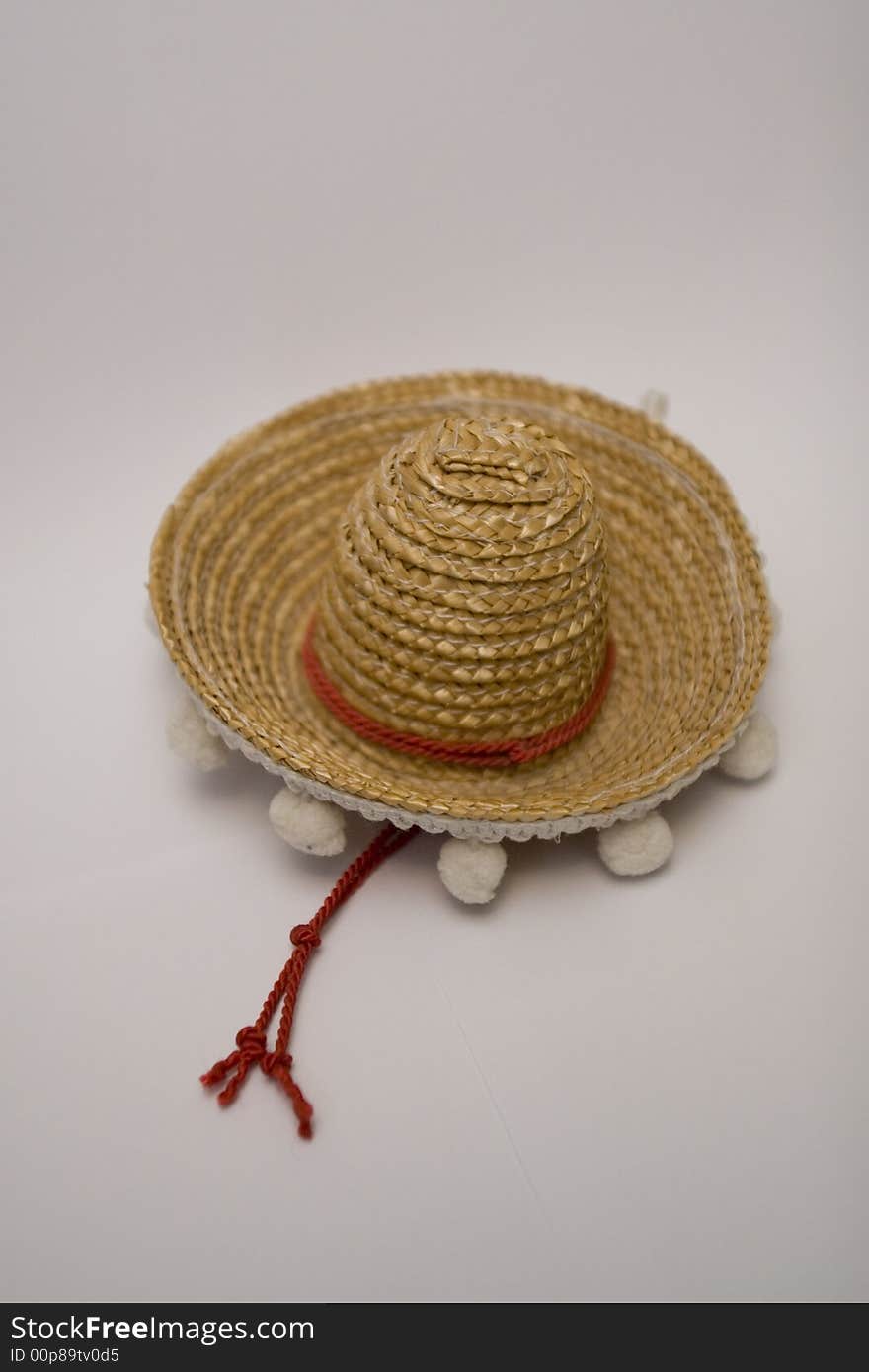 Novelty Miniature mexican yellow straw Sombrero hat with white trimming. Novelty Miniature mexican yellow straw Sombrero hat with white trimming