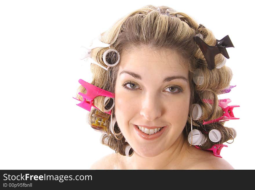 Gorgeous girl in rollers isolated on white