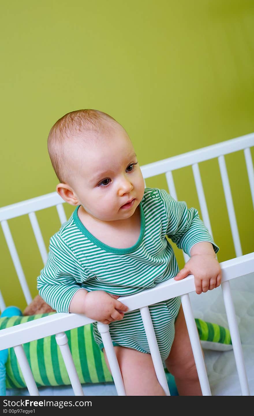 Portrait of little baby in crib