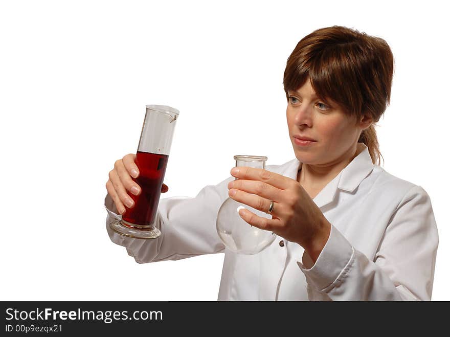 Cute young lady scientist in white coat, holding flask and red liquid, isolated on white. Cute young lady scientist in white coat, holding flask and red liquid, isolated on white