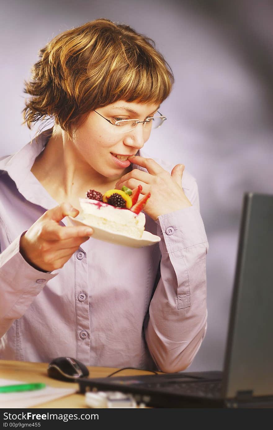 Miss with a cake in an office