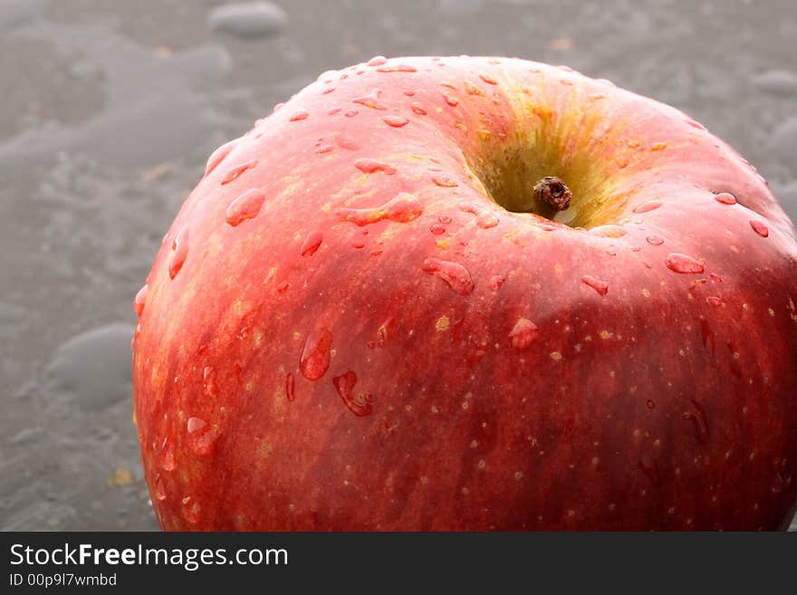 Macro red apple, with drops of water