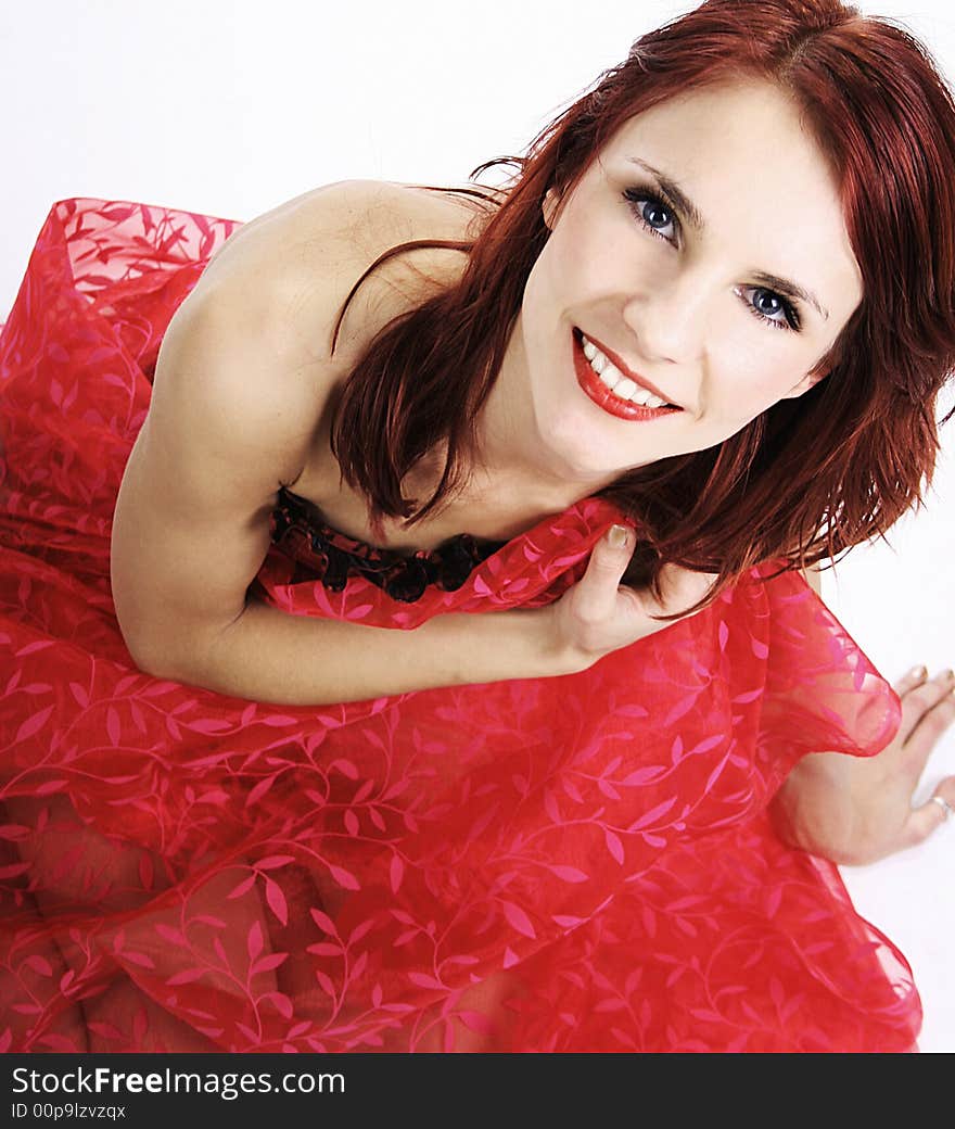 redhead girl in red dress isolated on white background. redhead girl in red dress isolated on white background