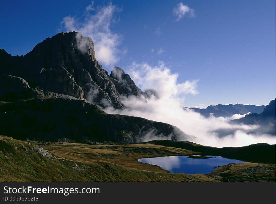 Rocks, clouds and lake