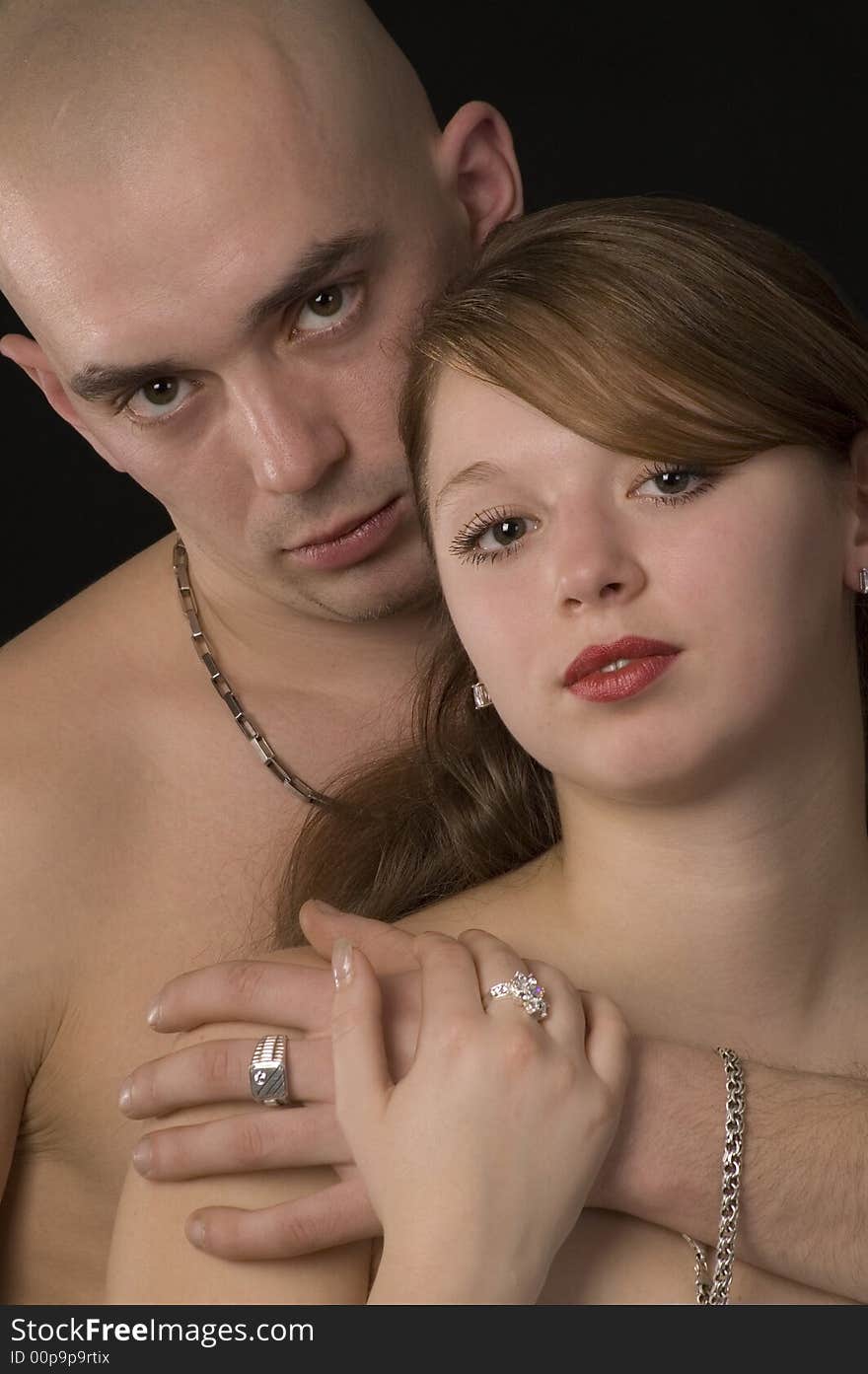 Portrait of beauty young couple, on a black background. Portrait of beauty young couple, on a black background.