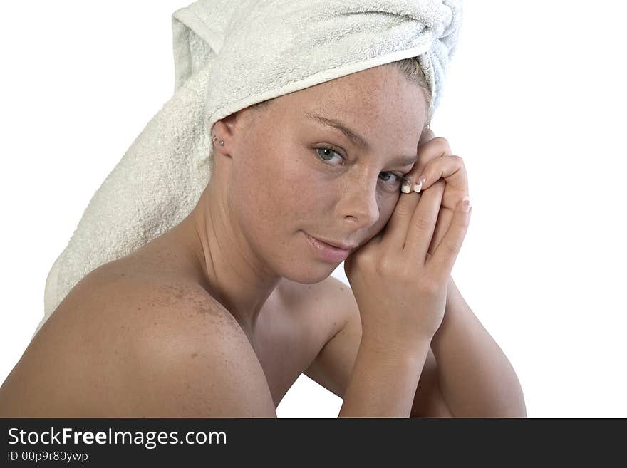 Studio portrait of a spa girl with a towel around her head. Studio portrait of a spa girl with a towel around her head