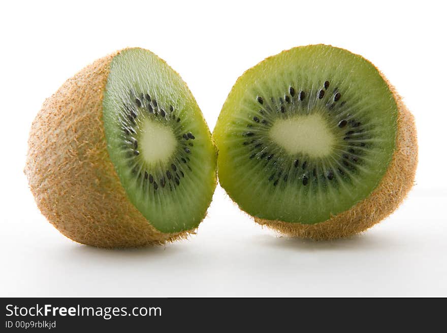 Two kiwi halves on white background