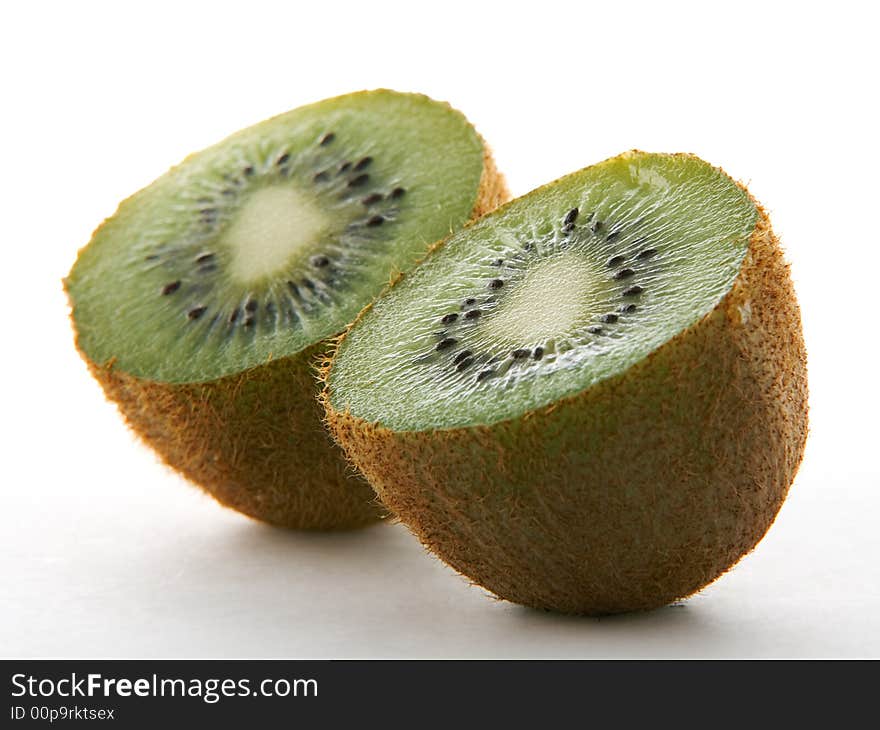 Two kiwi halves on white background