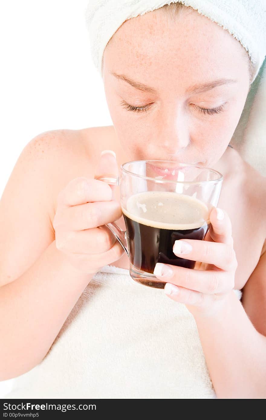 Studio portrait of a spa girl smelling her coffee. Studio portrait of a spa girl smelling her coffee