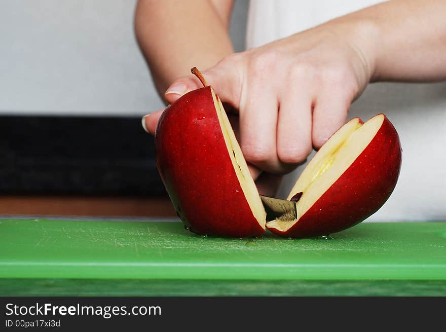 Apple on the counter symbolizes healthy living and nutritional value. Apple on the counter symbolizes healthy living and nutritional value