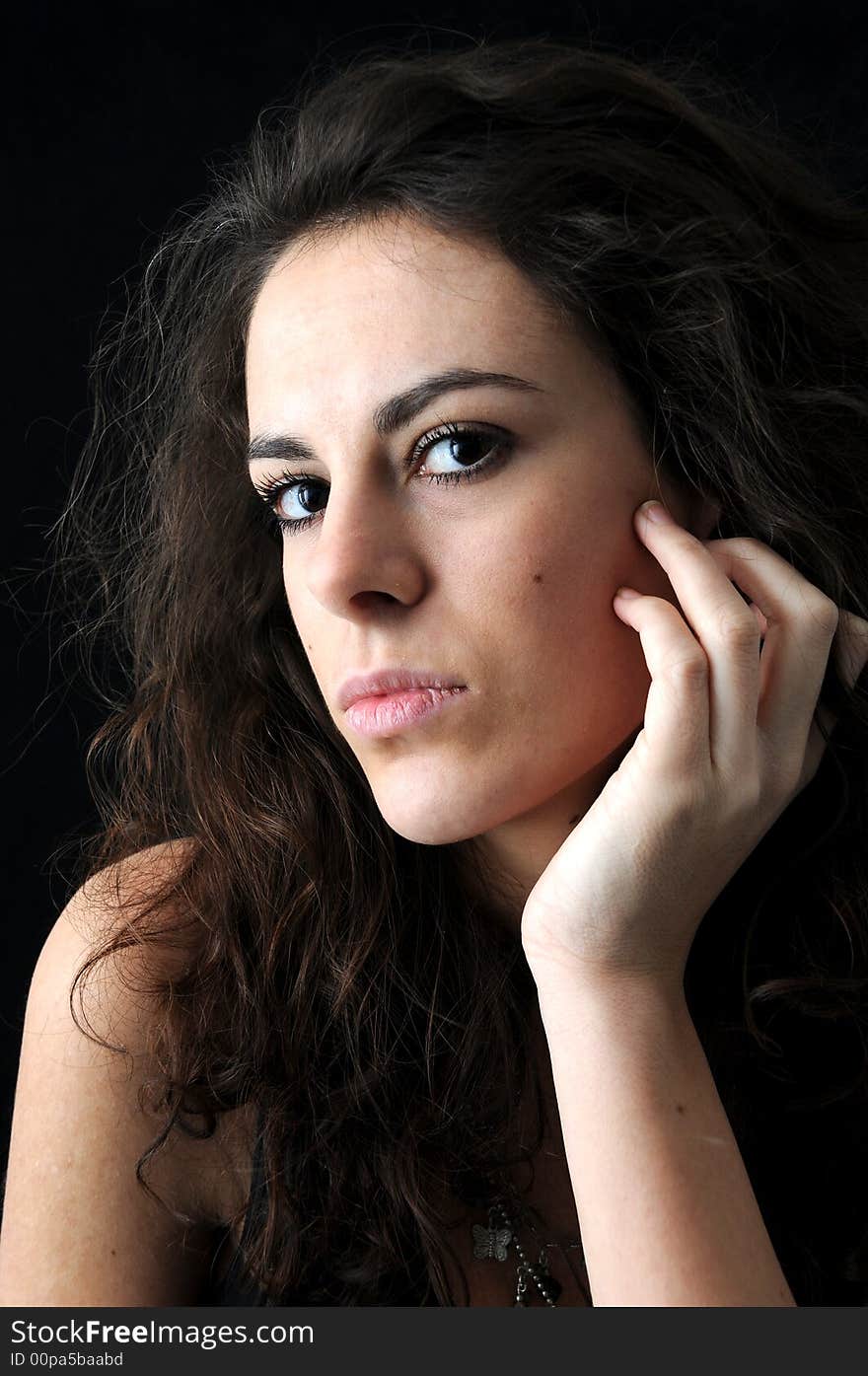 Beautiful brunette on black background