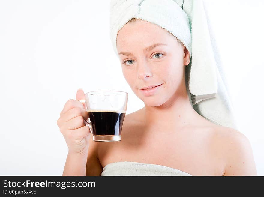 Studio portrait of a spa girl drinking coffee and making eye contact. Studio portrait of a spa girl drinking coffee and making eye contact