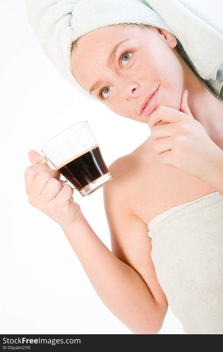 Studio portrait of a spa girl drinking coffee and thinking. Studio portrait of a spa girl drinking coffee and thinking