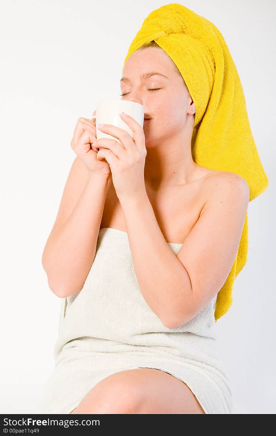 Studio portrait of a spa girl enjoying coffee. Studio portrait of a spa girl enjoying coffee