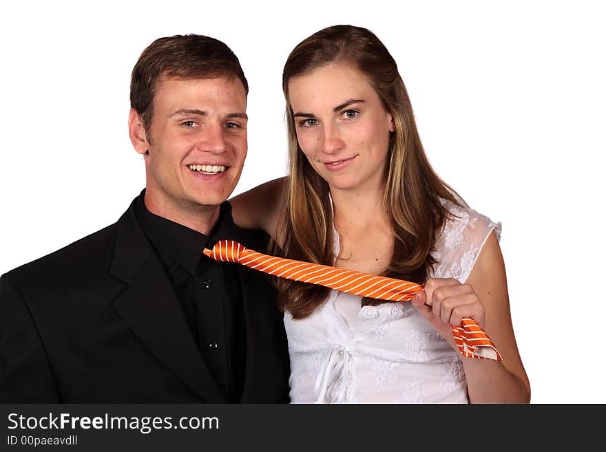 Young couple with lady pulling the man's tie. Young couple with lady pulling the man's tie