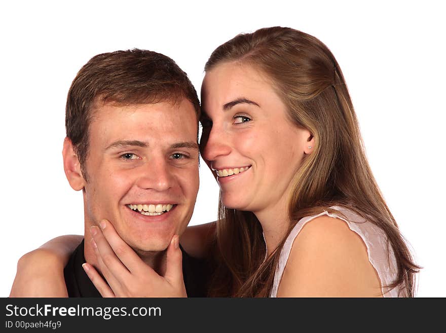 Girl whispering into her boyfriend's ear isolated