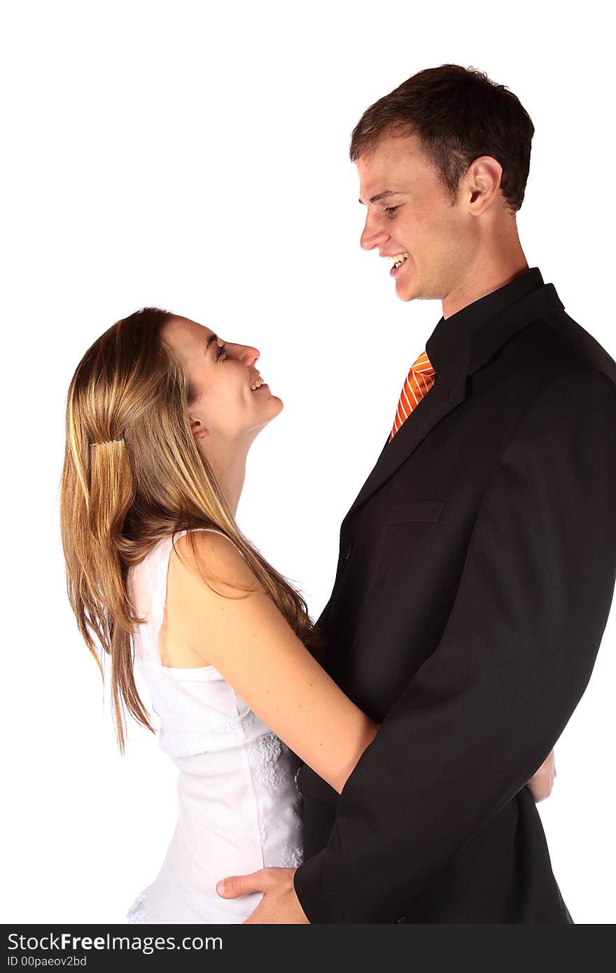 Young modern couple laughing at each other. Young modern couple laughing at each other