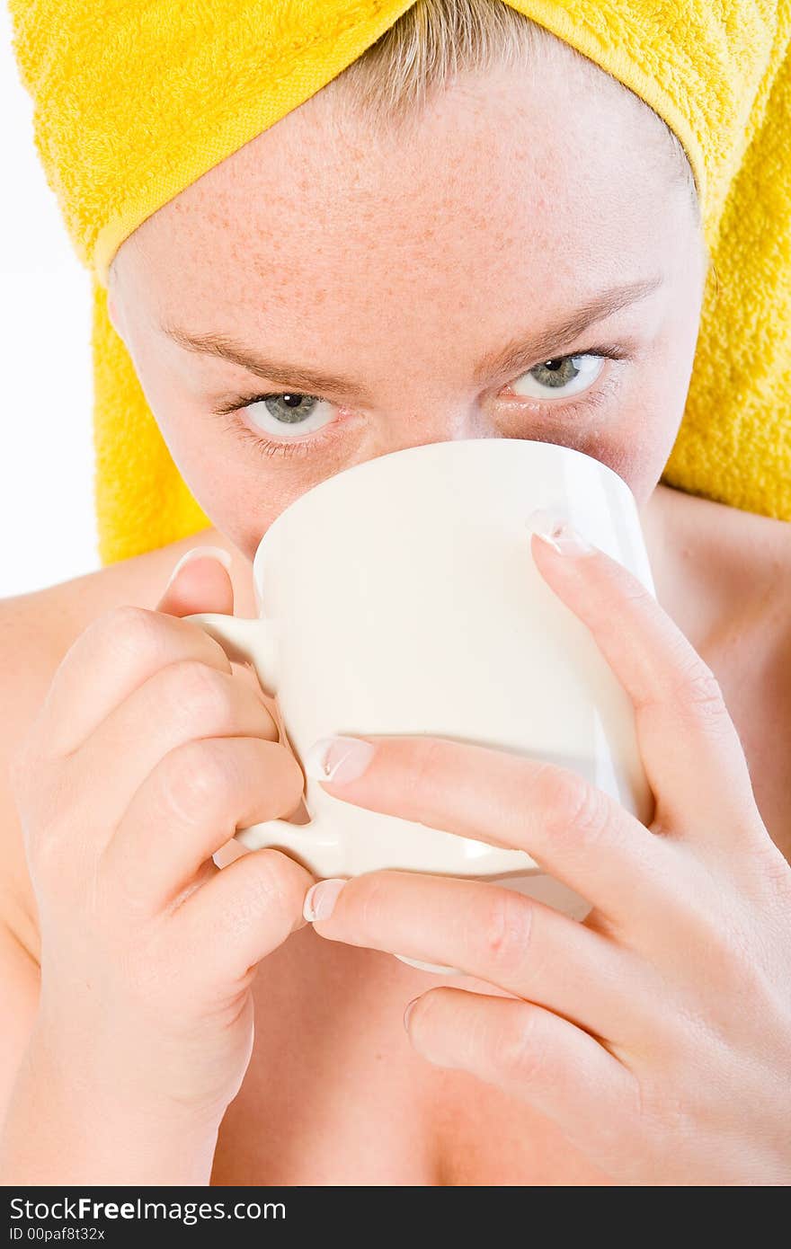 Studio portrait of a spa girl drinking coffee up close. Studio portrait of a spa girl drinking coffee up close