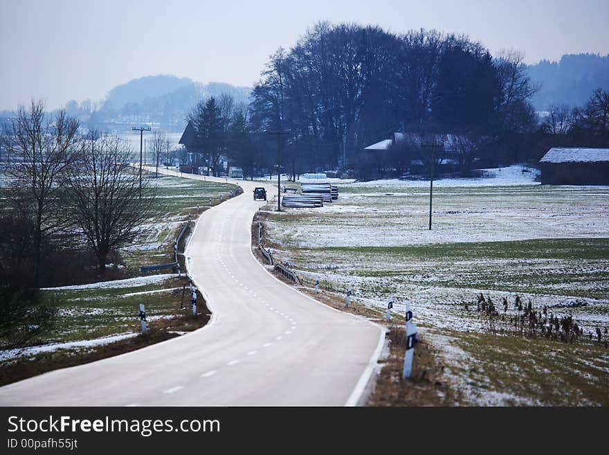 Winter road with snow covered landscape