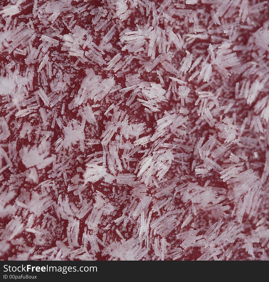 Ice crystals on a red background