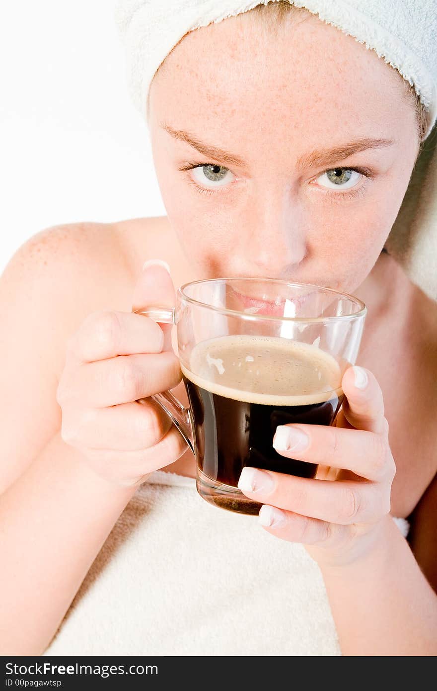 Studio portrait of a spa girl smelling her morning coffee. Studio portrait of a spa girl smelling her morning coffee