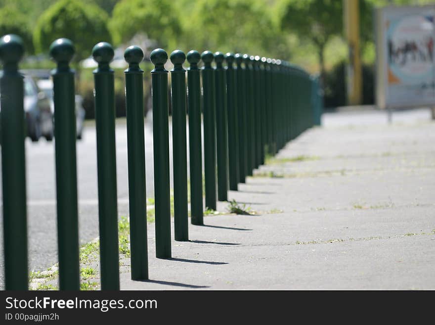 Green street poles in a city