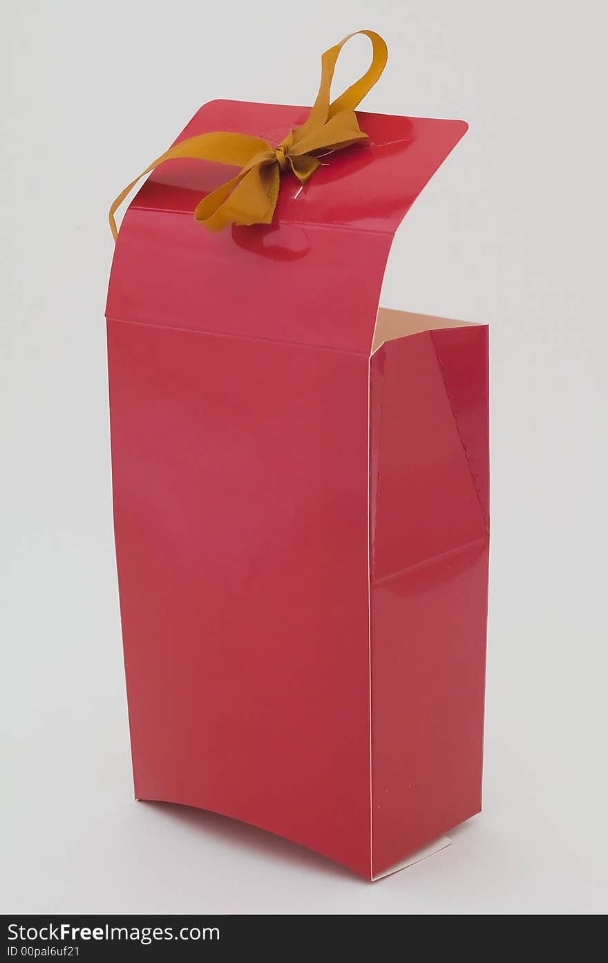 Photo of cardboard gift box with bow on cover