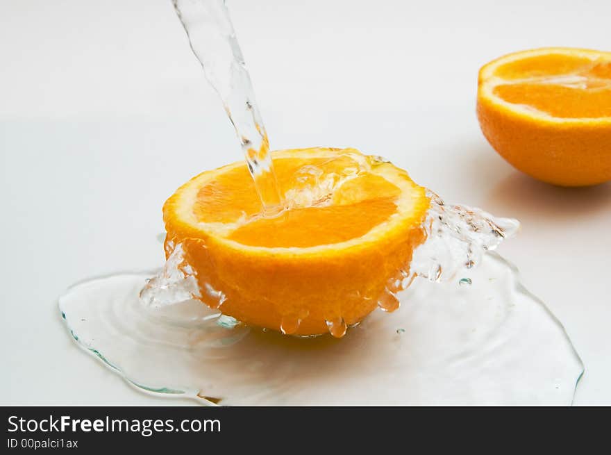 Two parts of an orange in water. Two parts of an orange in water