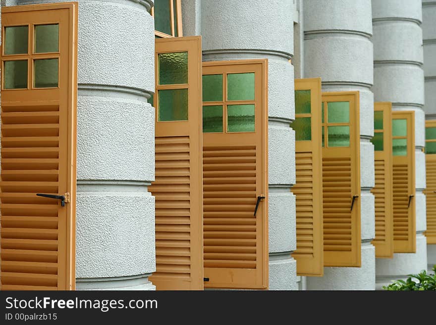 Series of yellow windows from a modern building.