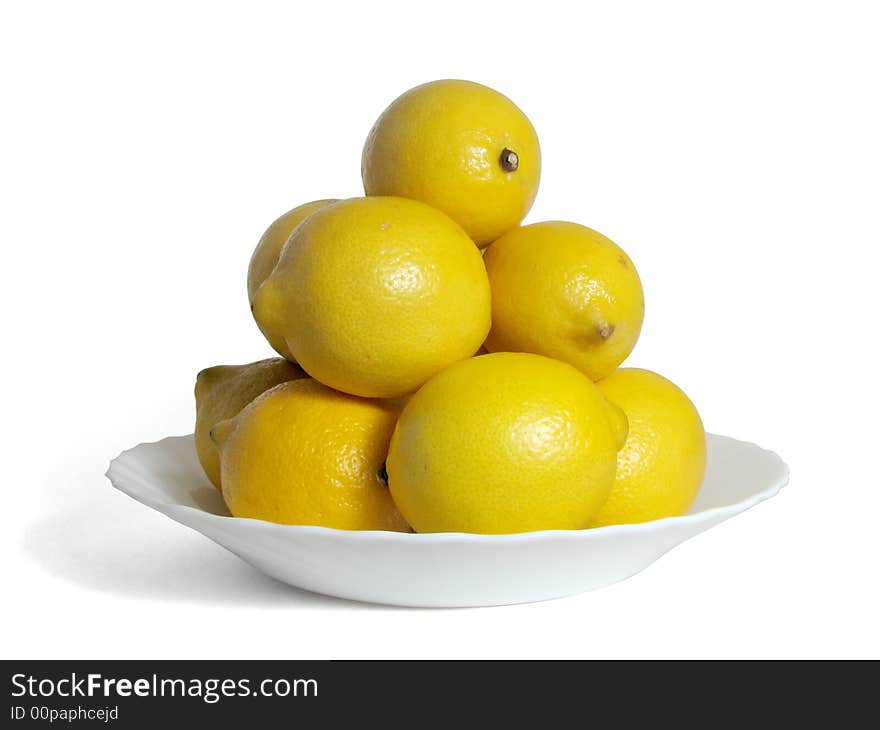 Hill of lemons on a white plate