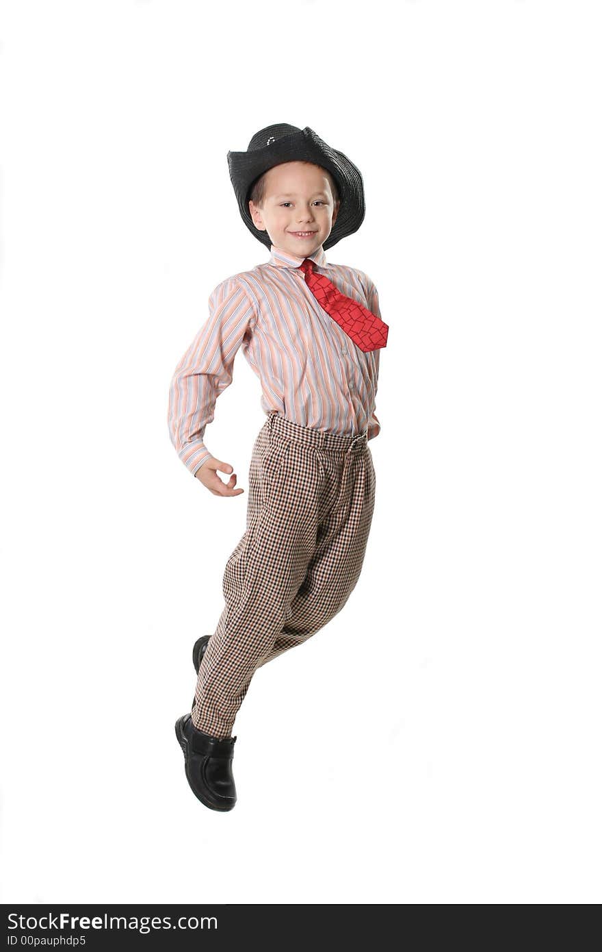 The cheerful boy in a cowboy's hat and a tie