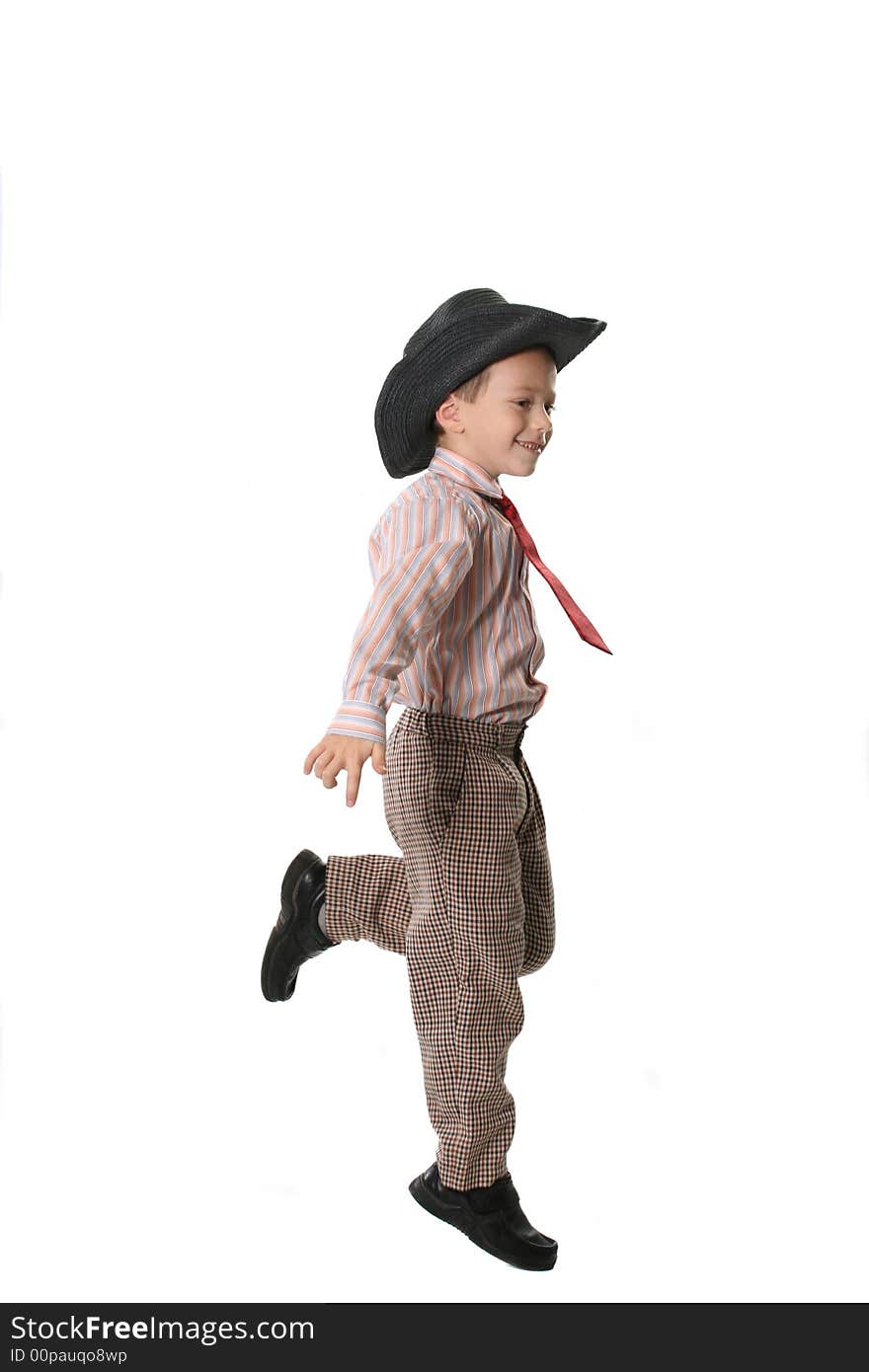 The cheerful boy in a cowboy's hat and a tie