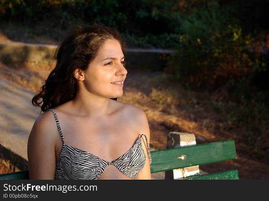 Girl looking at the distance in swimsuit in summer