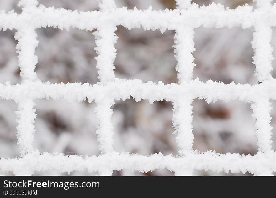 Fence covered with snow rime. Fence covered with snow rime