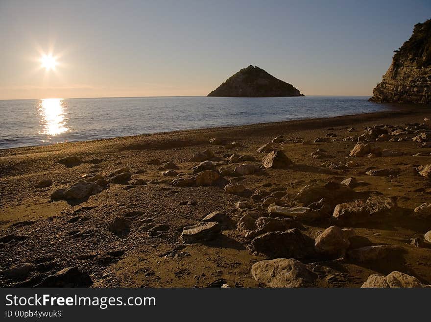 Deserted beach at sunrise