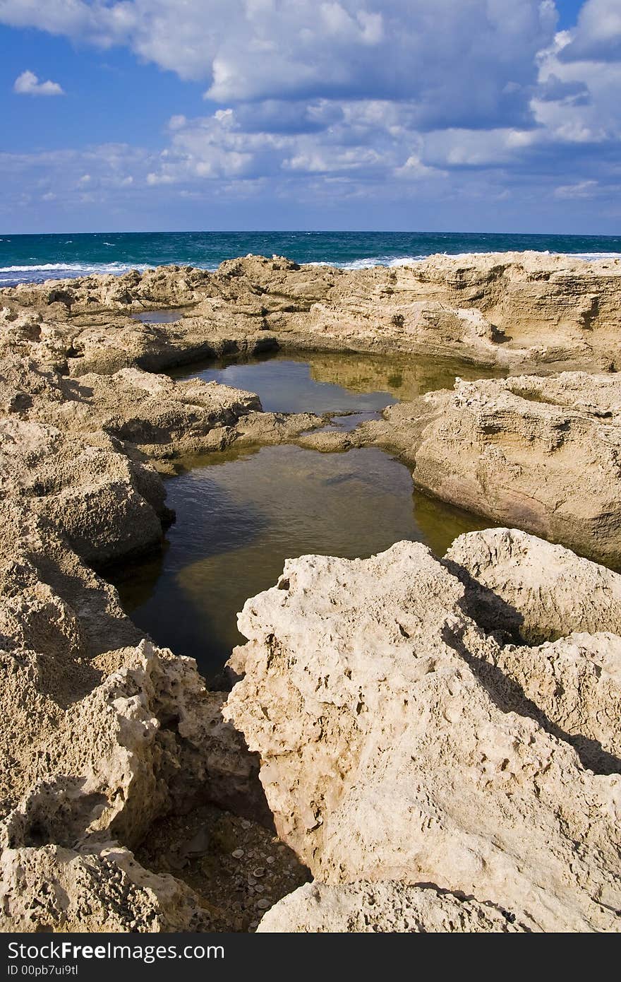 Sea water gathered in small rocky pools. Sea water gathered in small rocky pools.