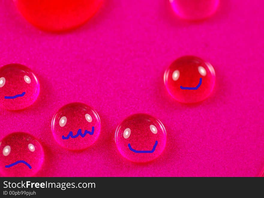 Close up shoot of pink colored water drops. Close up shoot of pink colored water drops