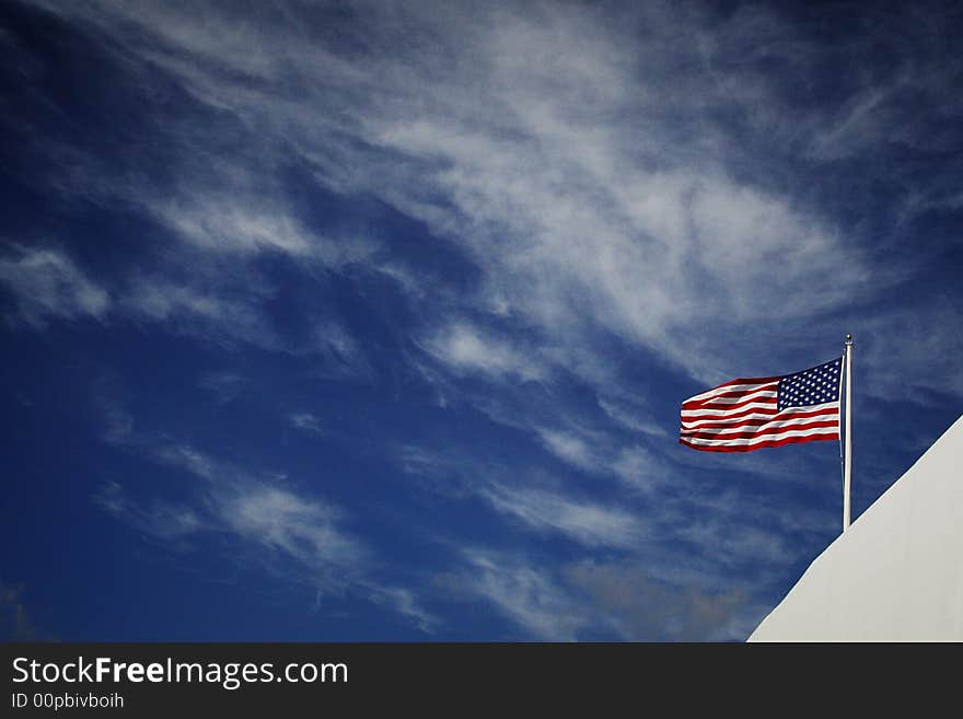 American flag with blue sky and white clould background. American flag with blue sky and white clould background