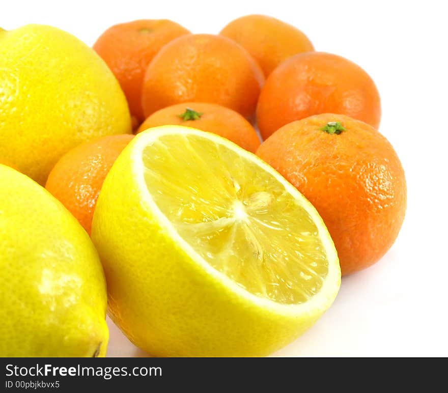 Ripe by mandarine orange and lemon tropic fruit isolated over white background with clipping path included. Ripe by mandarine orange and lemon tropic fruit isolated over white background with clipping path included