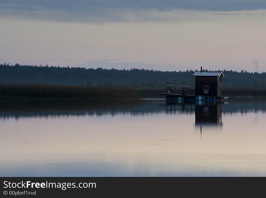 Small house reflecting in the river. Small house reflecting in the river