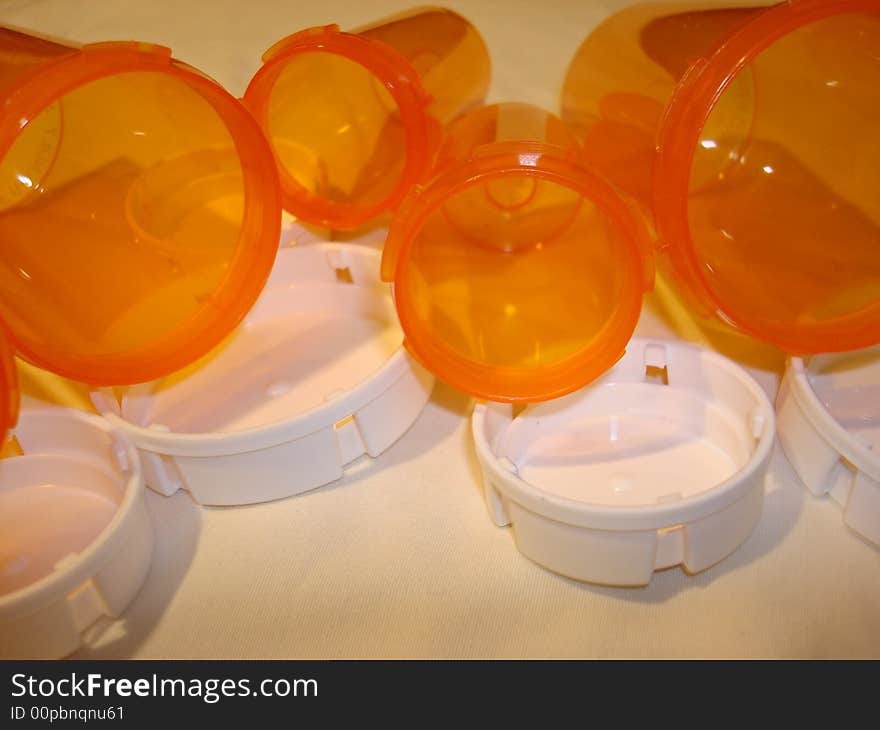 Empty and open pharmaceutical bottles.