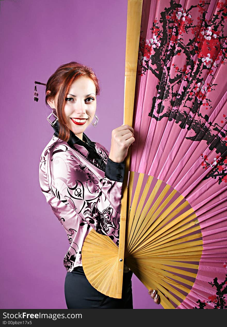 Charming geisha with japanese fan. Charming geisha with japanese fan