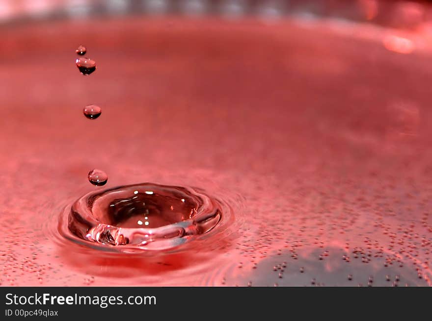 Levitating drop and ripple on the water surface. Levitating drop and ripple on the water surface.