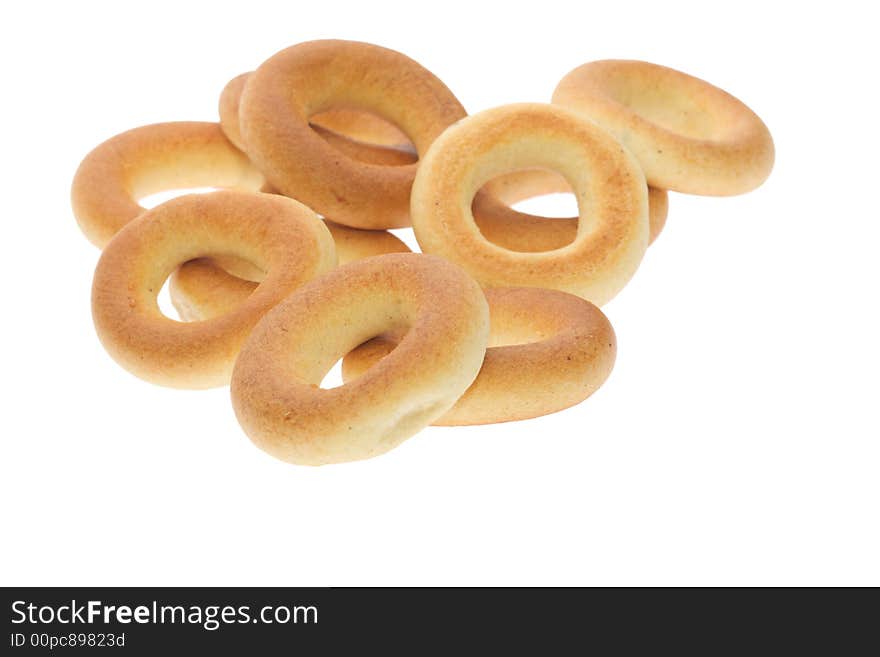 Heap of bagels isolated on white