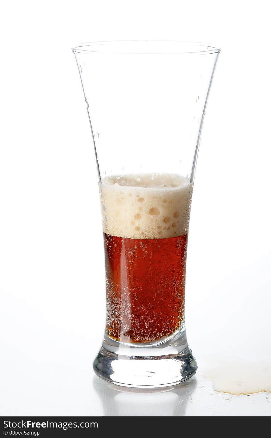 Glass with beer on the white background